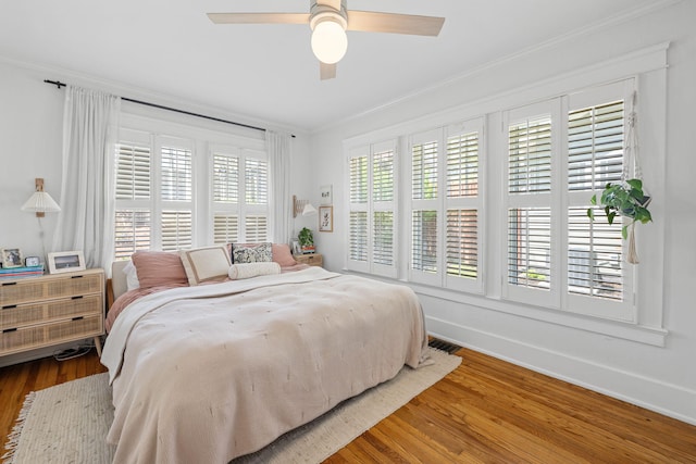 1209 Highland Dr, Chattanooga, TN 37405 - bedroom featuring crown molding, ceiling fan, visible vents, wood finished floors, and baseboards
