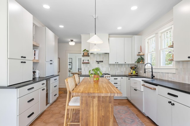 1209 Highland Dr, Chattanooga, TN 37405 - kitchen featuring backsplash, light tile patterned flooring, a sink, and open shelves