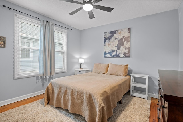 219 Martin Rd, Chattanooga, TN 37415 - bedroom featuring wood finished floors, baseboards, and a ceiling fan