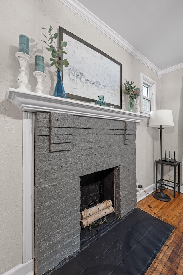 219 Martin Rd, Chattanooga, TN 37415 - detailed view of ornamental molding, wood finished floors, a brick fireplace, and baseboards