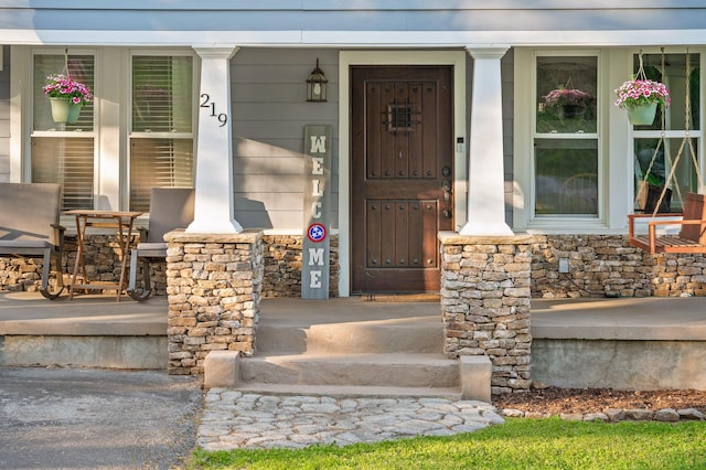 219 Martin Rd, Chattanooga, TN 37415 - view of exterior entry featuring a porch and stone siding
