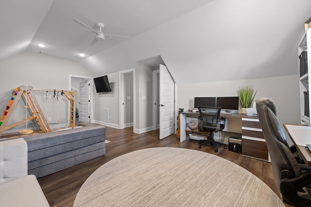 office area featuring a ceiling fan, vaulted ceiling, baseboards, visible vents, and wood finished floors