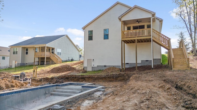back of property with ceiling fan, stairs, a deck, and crawl space
