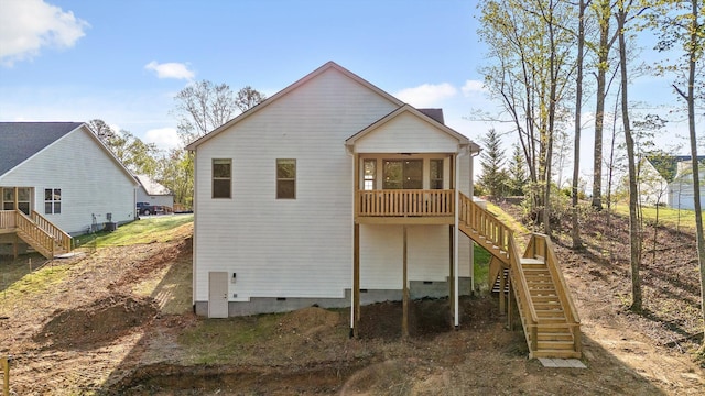 back of house featuring crawl space, a deck, ceiling fan, and stairs