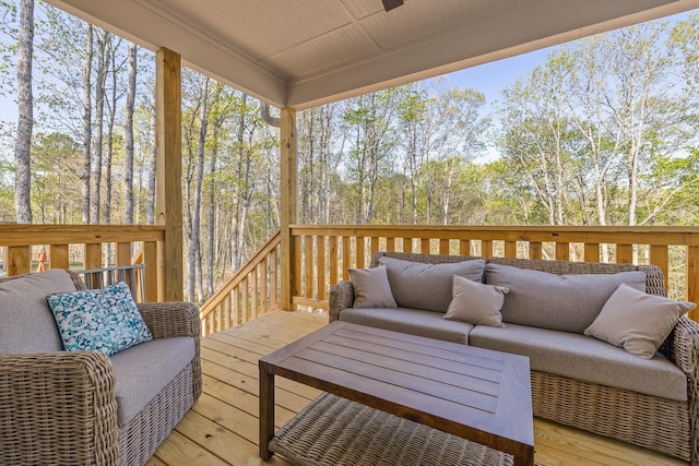 wooden deck with an outdoor living space