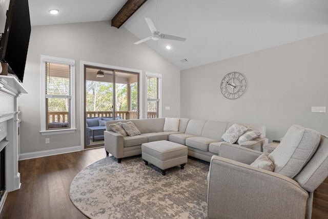 living room featuring wood finished floors, beam ceiling, a fireplace, ceiling fan, and baseboards
