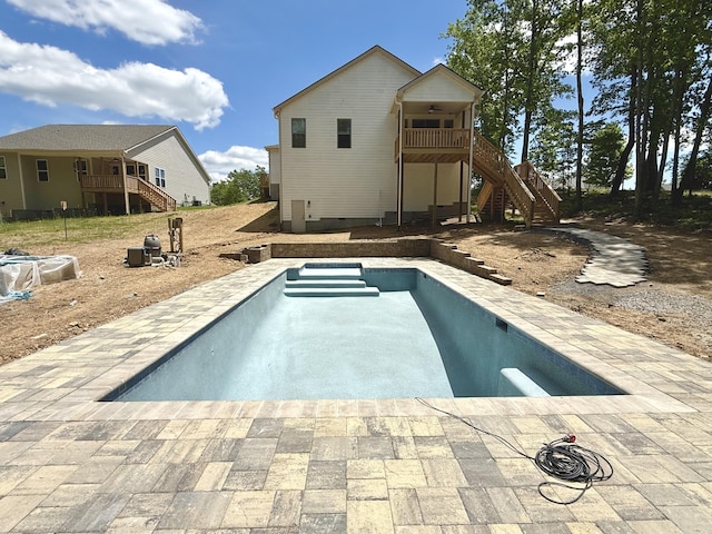 view of pool featuring stairs and an empty pool