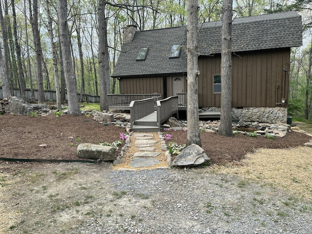 43 Miller Cove Cir, Signal Mountain, TN 37377 - back of house featuring a chimney, a deck, board and batten siding, and a shingled roof