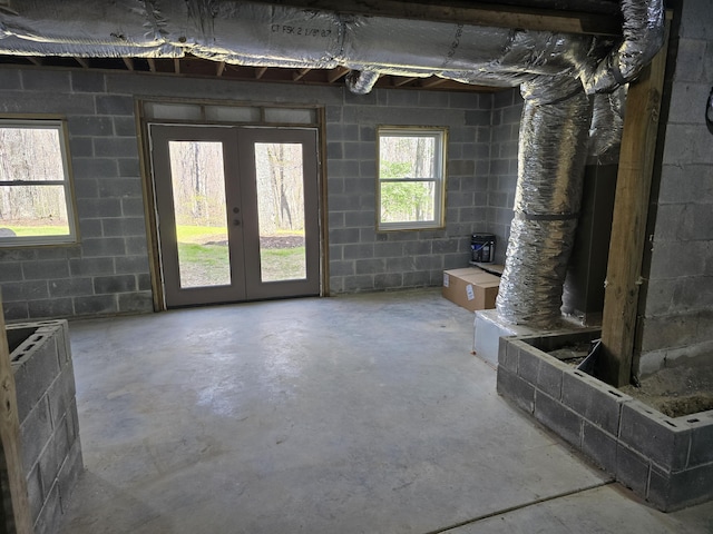 43 Miller Cove Cir, Signal Mountain, TN 37377 - bathroom featuring unfinished concrete flooring, french doors, and concrete block wall