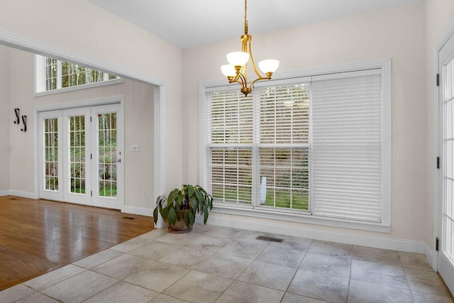 7111 River Run Dr, Chattanooga, TN 37416 - unfurnished dining area featuring visible vents, baseboards, and an inviting chandelier