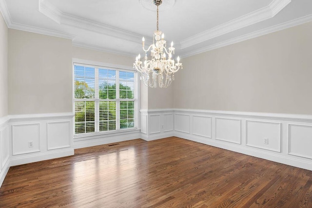 7111 River Run Dr, Chattanooga, TN 37416 - spare room with a raised ceiling, wainscoting, an inviting chandelier, and wood finished floors