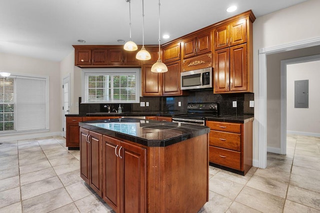 7111 River Run Dr, Chattanooga, TN 37416 - kitchen featuring tasteful backsplash, electric panel, a center island, appliances with stainless steel finishes, and a sink