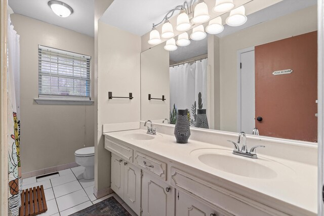 1905 Bella Vista Dr, Chattanooga, TN 37421 - full bathroom with toilet, double vanity, tile patterned floors, and baseboards