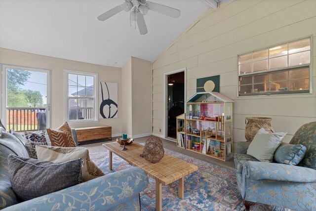 1905 Bella Vista Dr, Chattanooga, TN 37421 - carpeted living room featuring a ceiling fan, wooden walls, and baseboards