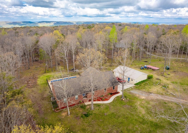 bird's eye view featuring a forest view