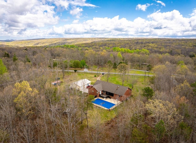 aerial view featuring a rural view and a view of trees