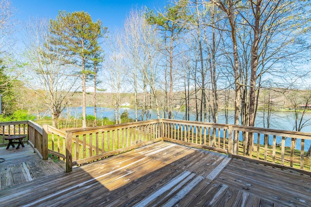 wooden deck featuring a water view