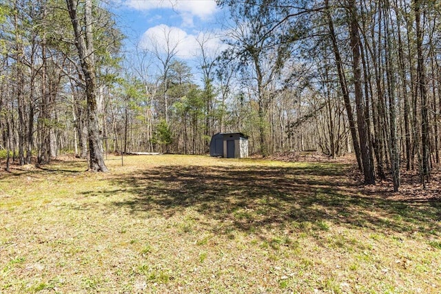 255 Bible Gulf Rd, Menlo, GA 30731 - view of yard featuring a wooded view, an outdoor structure, and a shed