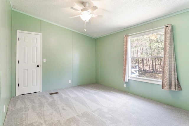 255 Bible Gulf Rd, Menlo, GA 30731 - carpeted empty room featuring a textured ceiling, ornamental molding, a ceiling fan, and visible vents