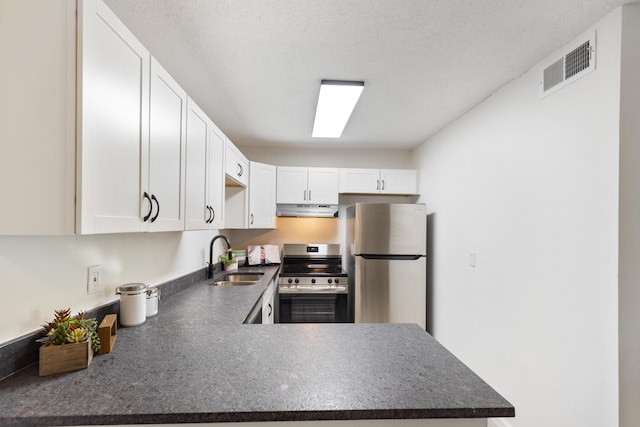 900 Mountain Creek Rd # R311, Chattanooga, TN 37405 - kitchen featuring stainless steel appliances, under cabinet range hood, dark countertops, and white cabinets