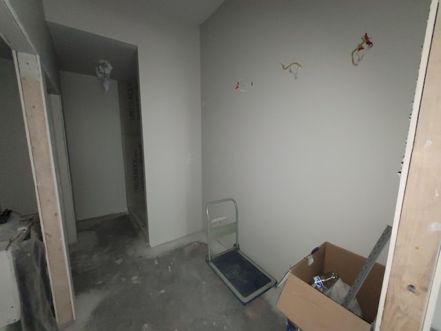 bathroom with unfinished concrete flooring