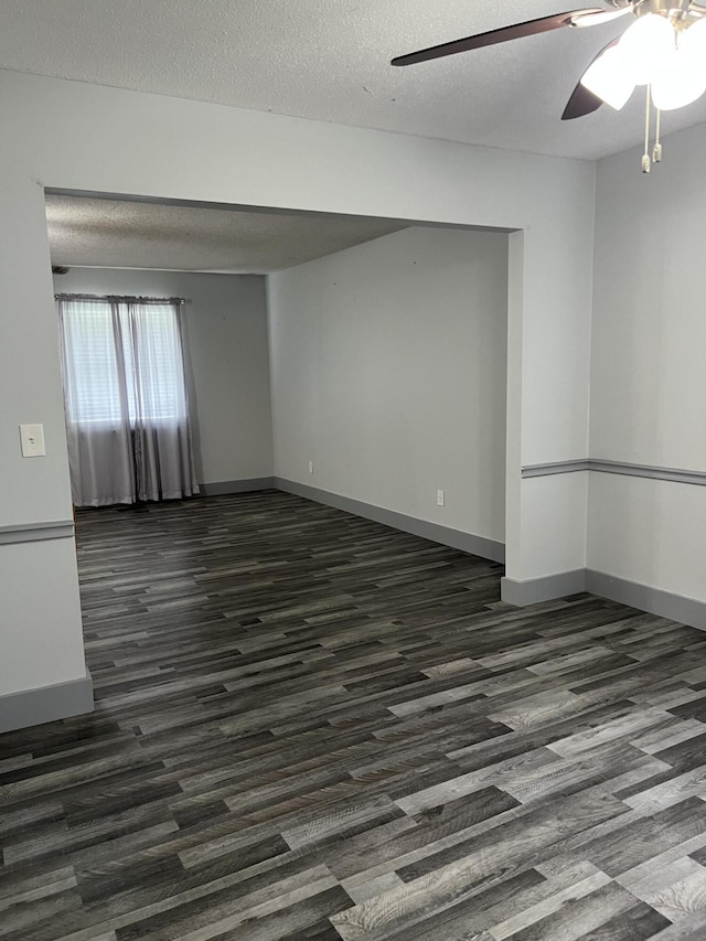 9121 Potomac Dr, Chattanooga, TN 37421 - spare room with dark wood-style flooring, ceiling fan, baseboards, and a textured ceiling