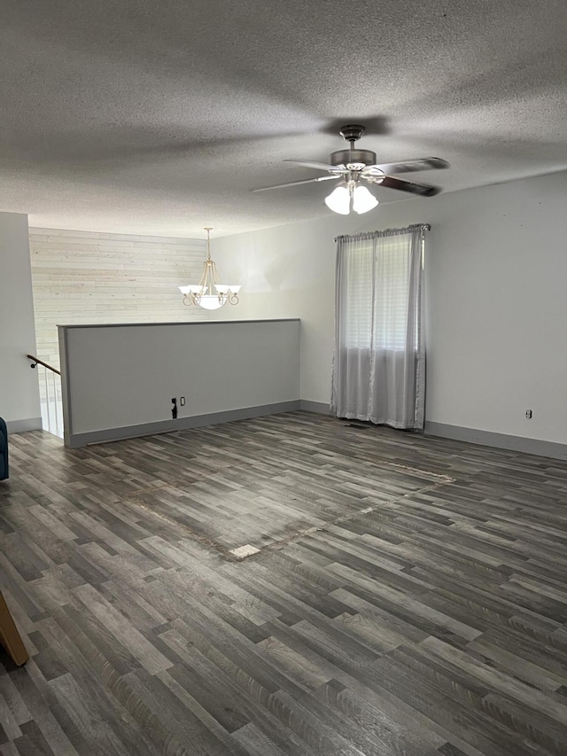 9121 Potomac Dr, Chattanooga, TN 37421 - unfurnished living room featuring dark wood finished floors, a chandelier, baseboards, and a textured ceiling