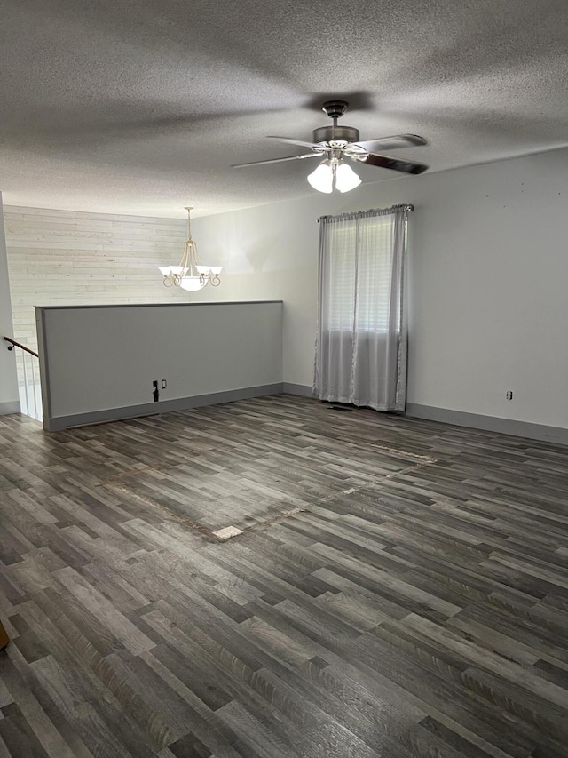 9121 Potomac Dr, Chattanooga, TN 37421 - unfurnished living room featuring dark wood finished floors, baseboards, a textured ceiling, a chandelier, and ceiling fan