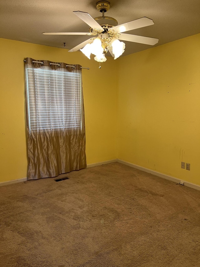 9121 Potomac Dr, Chattanooga, TN 37421 - carpeted empty room with a ceiling fan, a textured ceiling, and baseboards