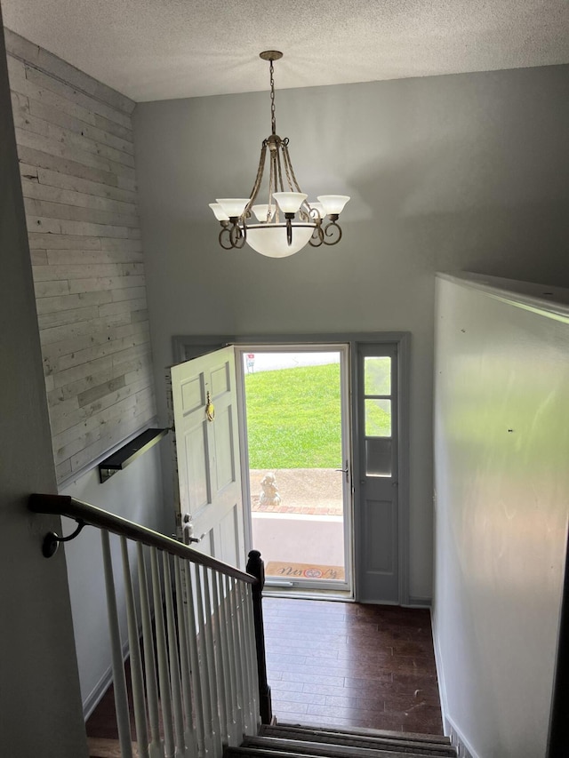 9121 Potomac Dr, Chattanooga, TN 37421 - foyer featuring a chandelier, a textured ceiling, and wood finished floors