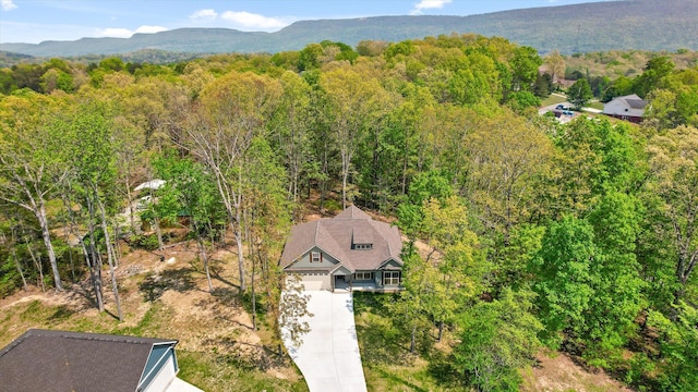 bird's eye view featuring a view of trees and a mountain view