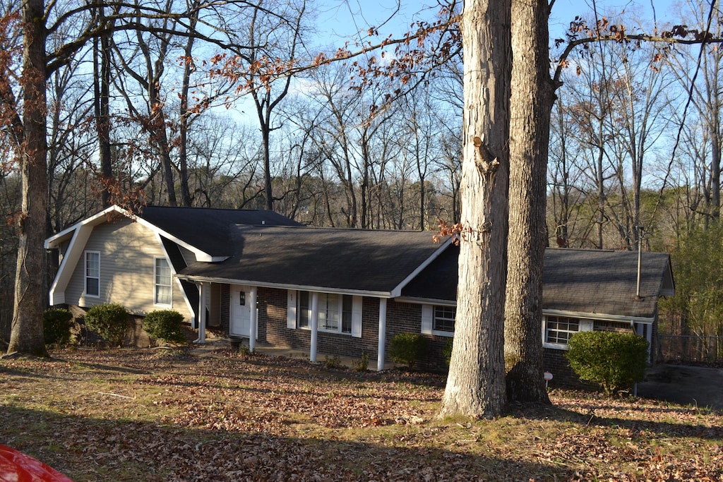 single story home with brick siding