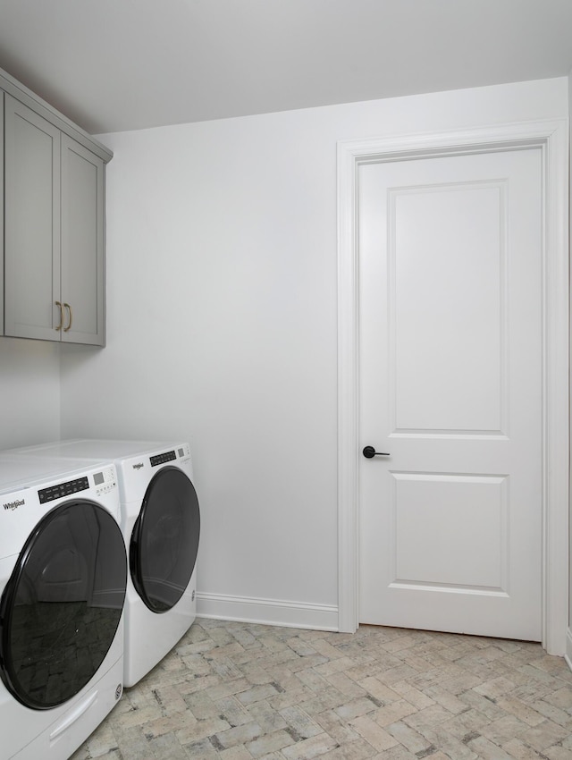 92 Lemonade St, Chattanooga, TN 37421 - laundry room with washing machine and clothes dryer, cabinet space, and brick patterned flooring