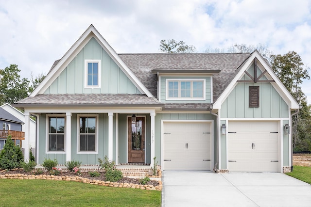92 Lemonade St, Chattanooga, TN 37421 - view of front of property featuring board and batten siding, driveway, roof with shingles, and covered porch