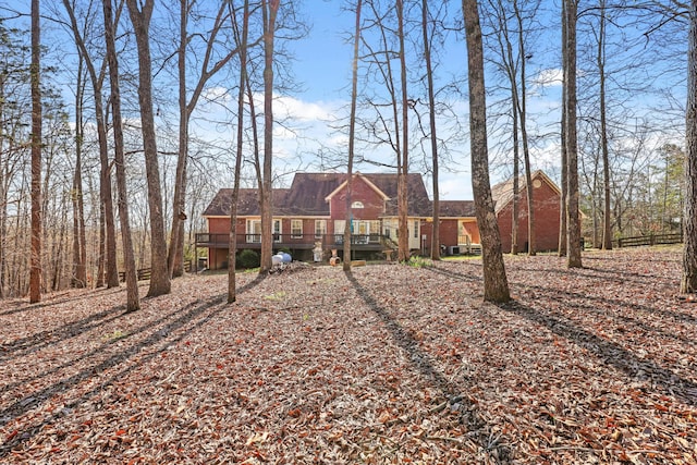view of front of property with a wooden deck