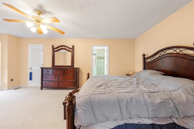 carpeted bedroom featuring a textured ceiling, baseboards, connected bathroom, and ceiling fan