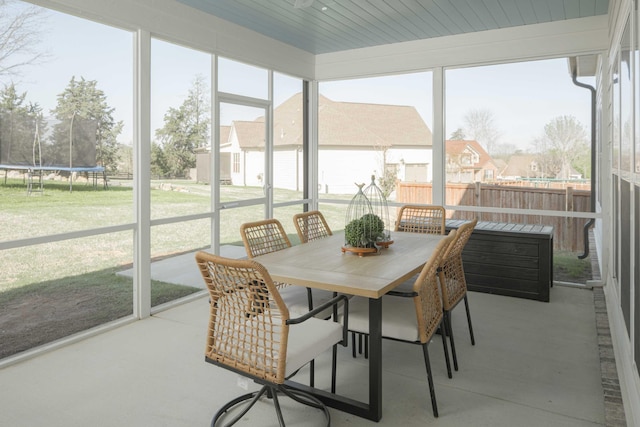 sunroom / solarium with outdoor dining space