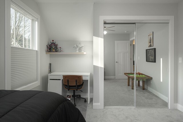 bedroom with light carpet and baseboards