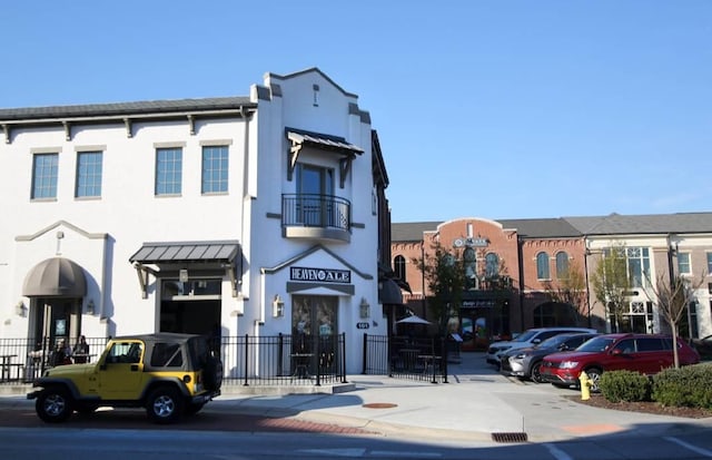 view of building exterior with fence