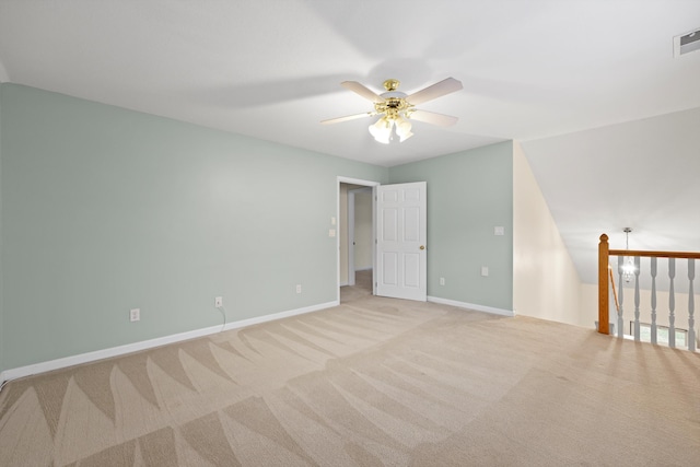 unfurnished room with light carpet, baseboards, a ceiling fan, and visible vents