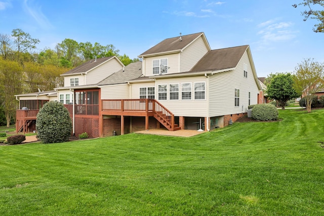back of house with a sunroom, a yard, cooling unit, stairs, and a wooden deck
