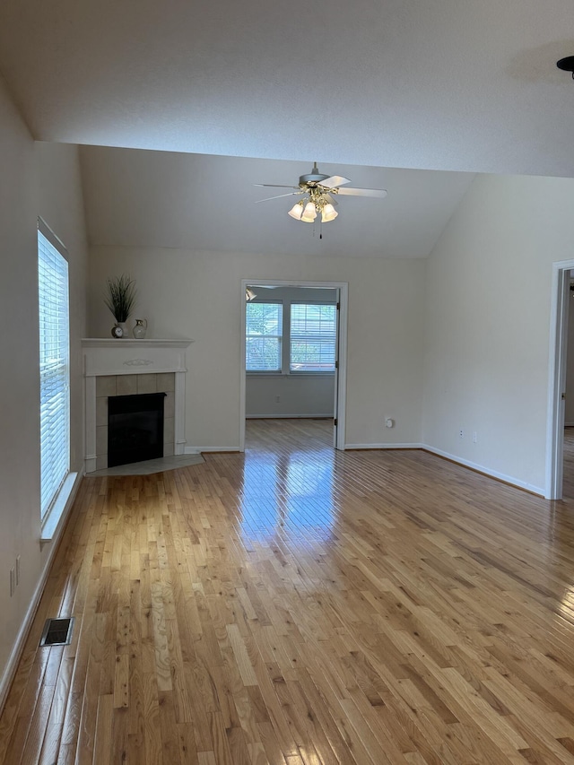 4521 Solomon Seal Trl, Chattanooga, TN 37415 - unfurnished living room with light wood-style flooring, ceiling fan, a fireplace, and lofted ceiling