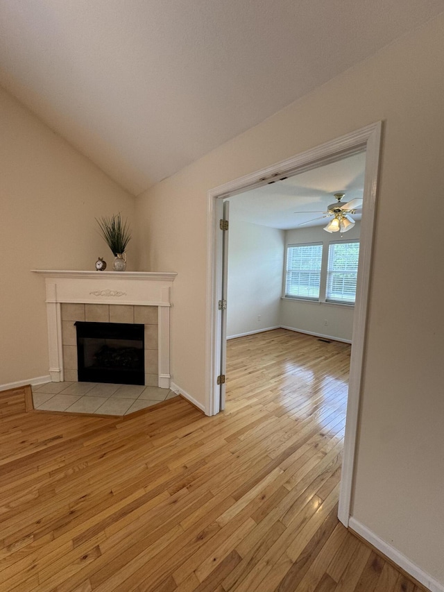 4521 Solomon Seal Trl, Chattanooga, TN 37415 - unfurnished living room featuring wood-type flooring, a fireplace, vaulted ceiling, and ceiling fan