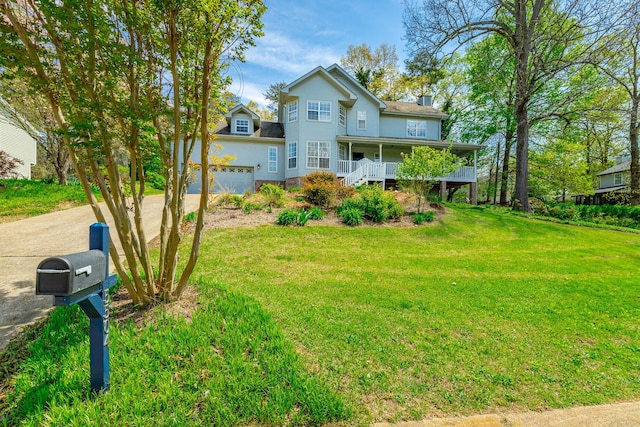 view of front of home with a front yard, roof with shingles, a chimney, and covered porch