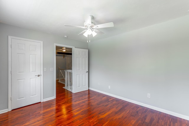 unfurnished bedroom featuring baseboards, a ceiling fan, and wood finished floors