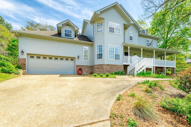 traditional-style house with a porch and driveway