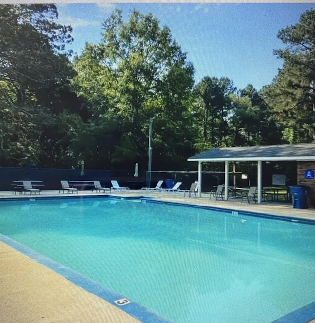 pool with a patio area