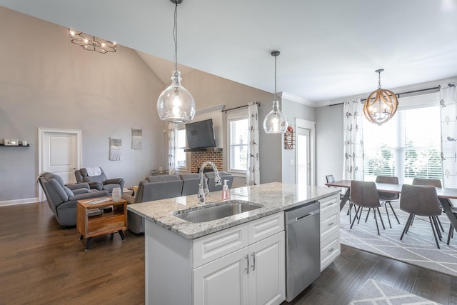 kitchen featuring a sink, a notable chandelier, dishwasher, a fireplace, and dark wood-type flooring