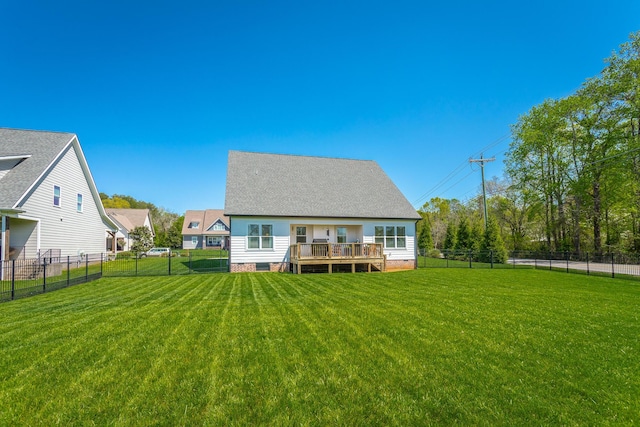 rear view of house with crawl space, a fenced backyard, a yard, and a deck