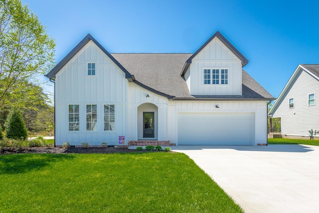 view of front of house featuring concrete driveway, board and batten siding, a shingled roof, and a front yard